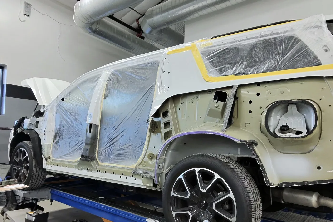 Paint preparation work underway at the Luxury Auto Body Round Rock shop